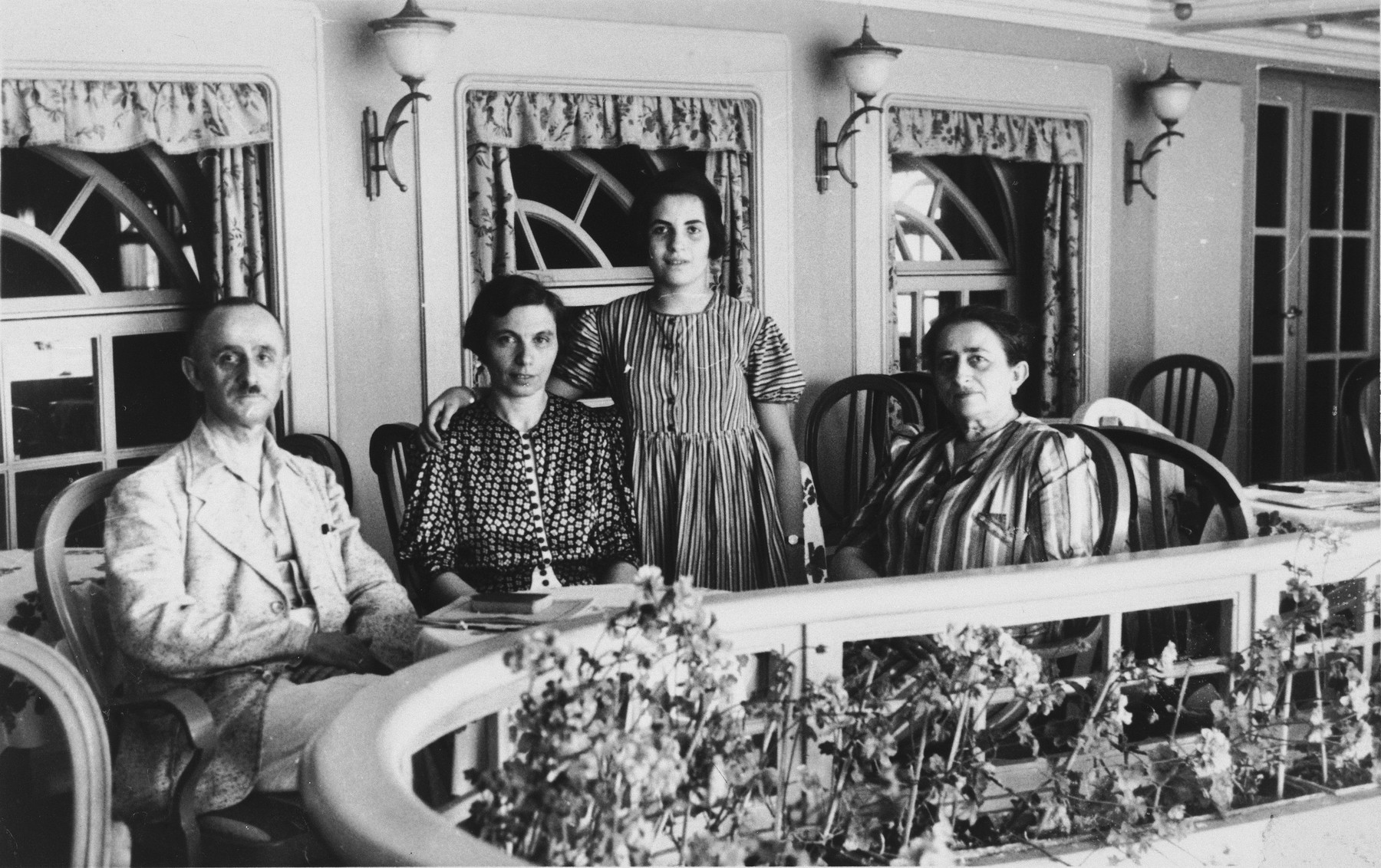 The Arndt family sits on deck of the St. Louis.

Pictured from left to right are Arthur Arndt, Hertha Arndt, Lieselotte Arndt, and Paula Kahnemann.