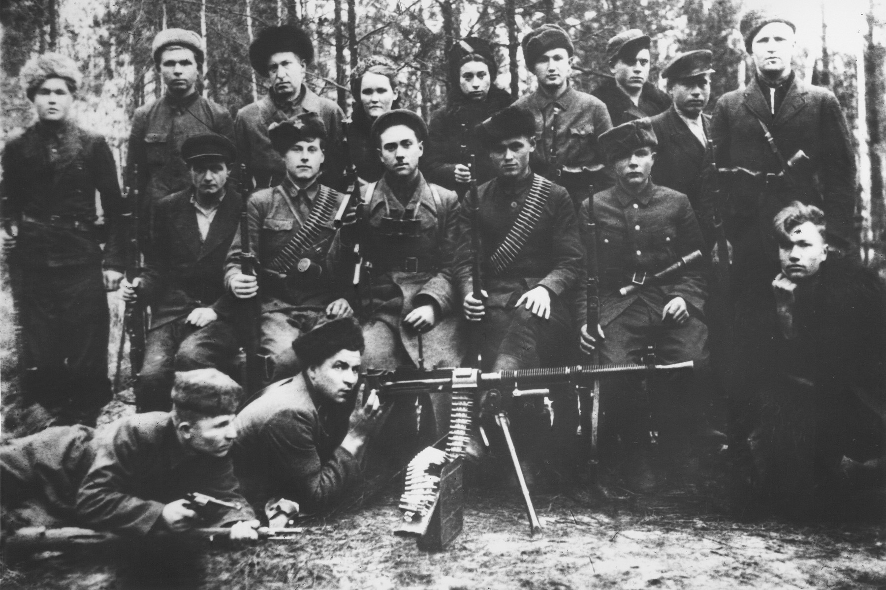 Group portrait of Soviet partisans who are members of the third unit of the Shish partisan detachment in the Molotov brigade, operating in the Leninsky district in the Pinsk region.