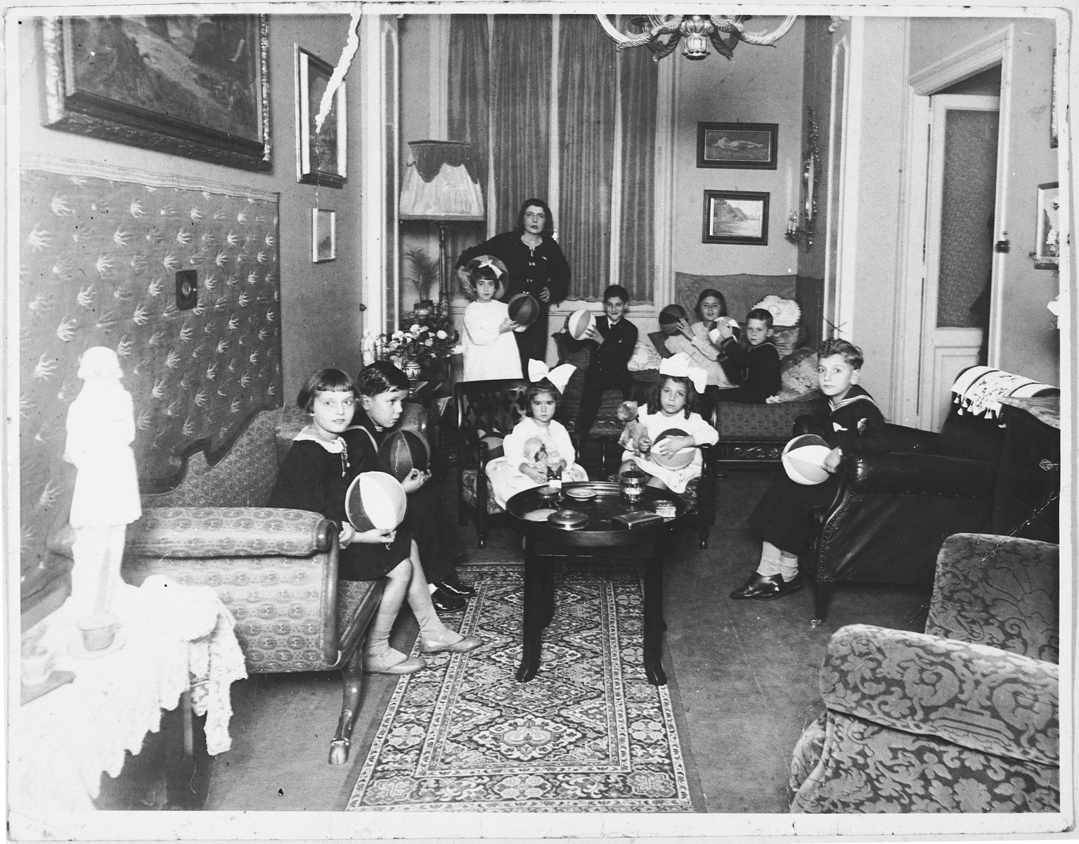 Jewish children attend a birthday party in an opulent apartment in Rome owned by a Hungarian Jewish woman.

Among those pictured are Serenella and Avishua Foa and their cousins, Anna and Andrea Bises.