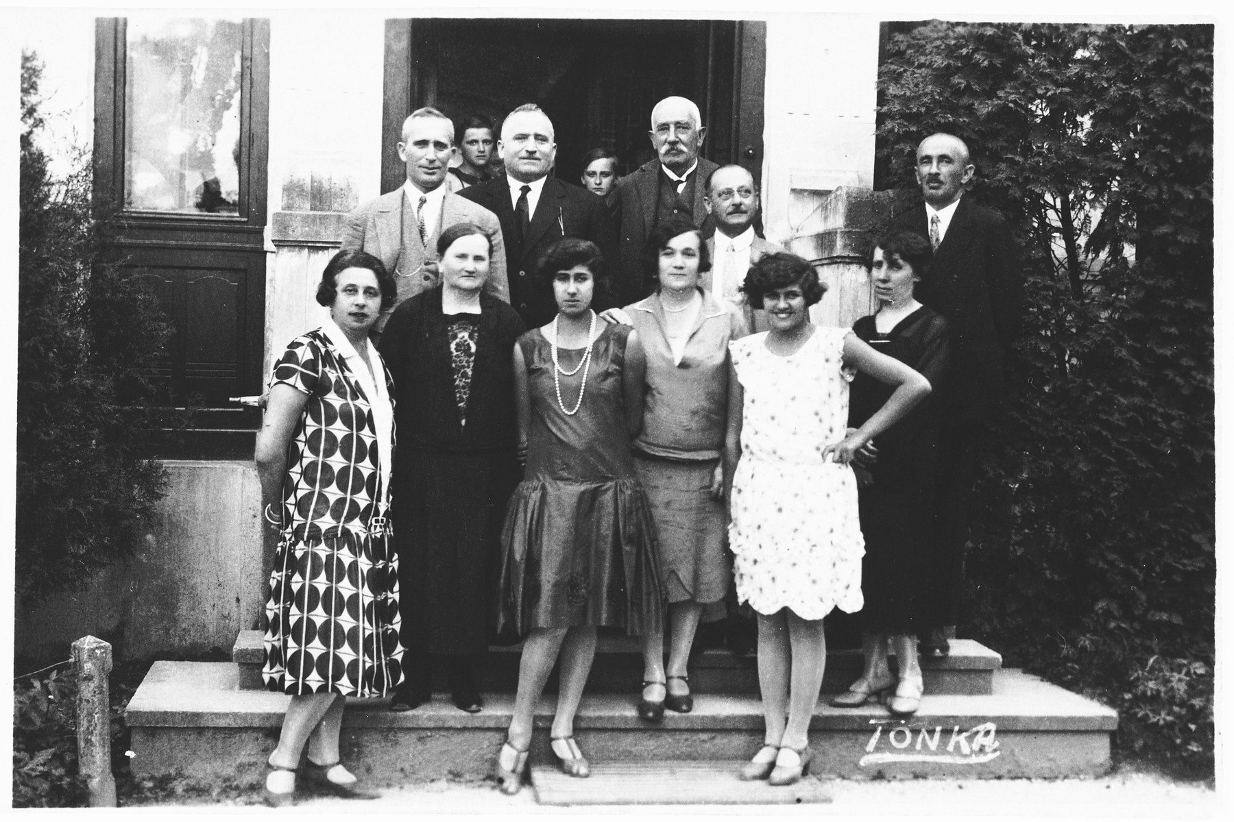 Members of the Spitzer family pose on the steps of a house in Osijek, Croatia.