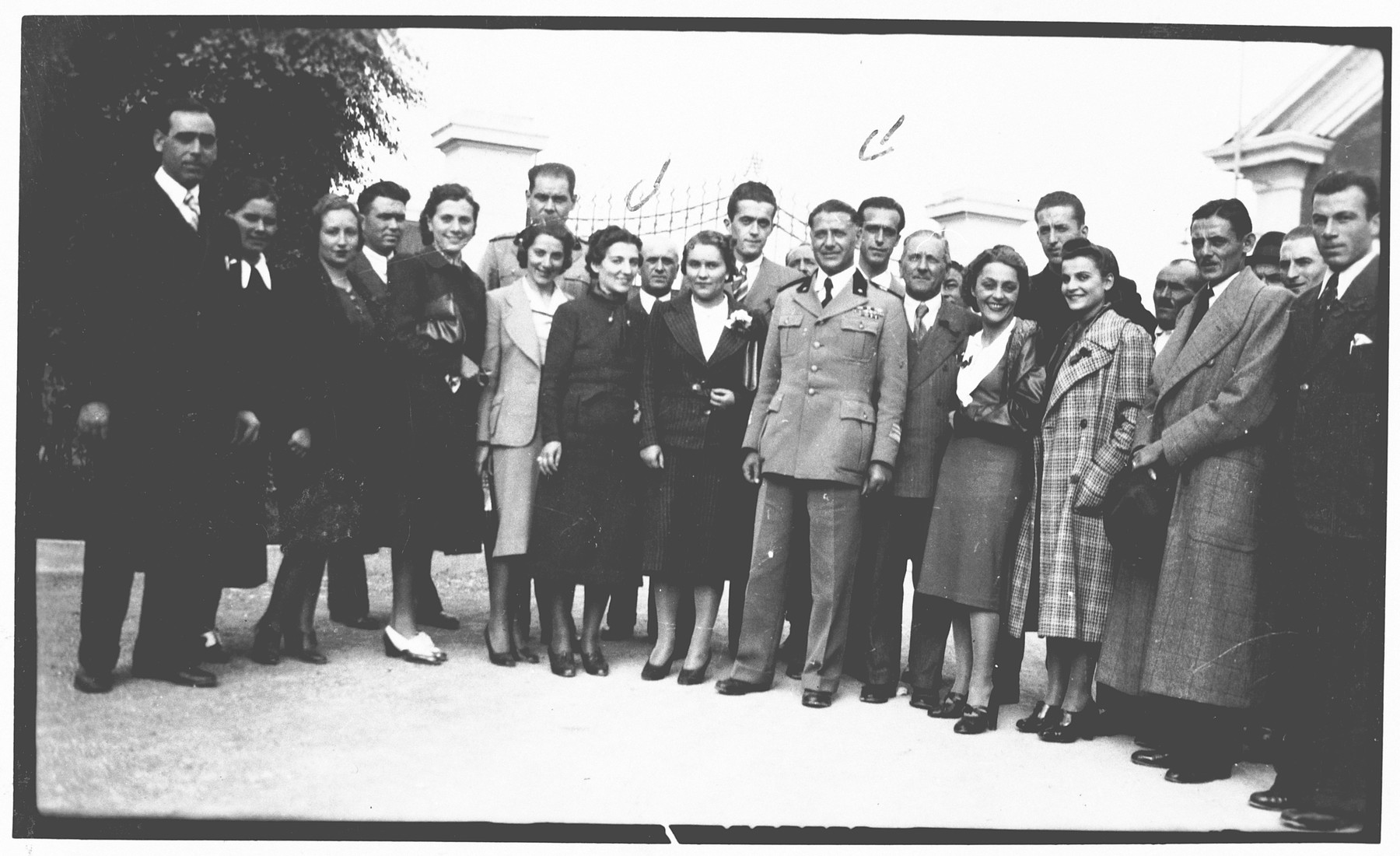 Aldo Foa poses with his co-workers from the army laboratory while on an office trip.

The workers presented this photograph to Aldo Foa as a going-away momento after Foa was fired from his post as a result of the discriminatory laws of 1938.

The inscription on the back of the photograph reads, "In memory of the beautiful trip; the workers of the separated Noceto's department give this album to their director Colonel Cavalier Aldo Foa who promoted it and made it possible."