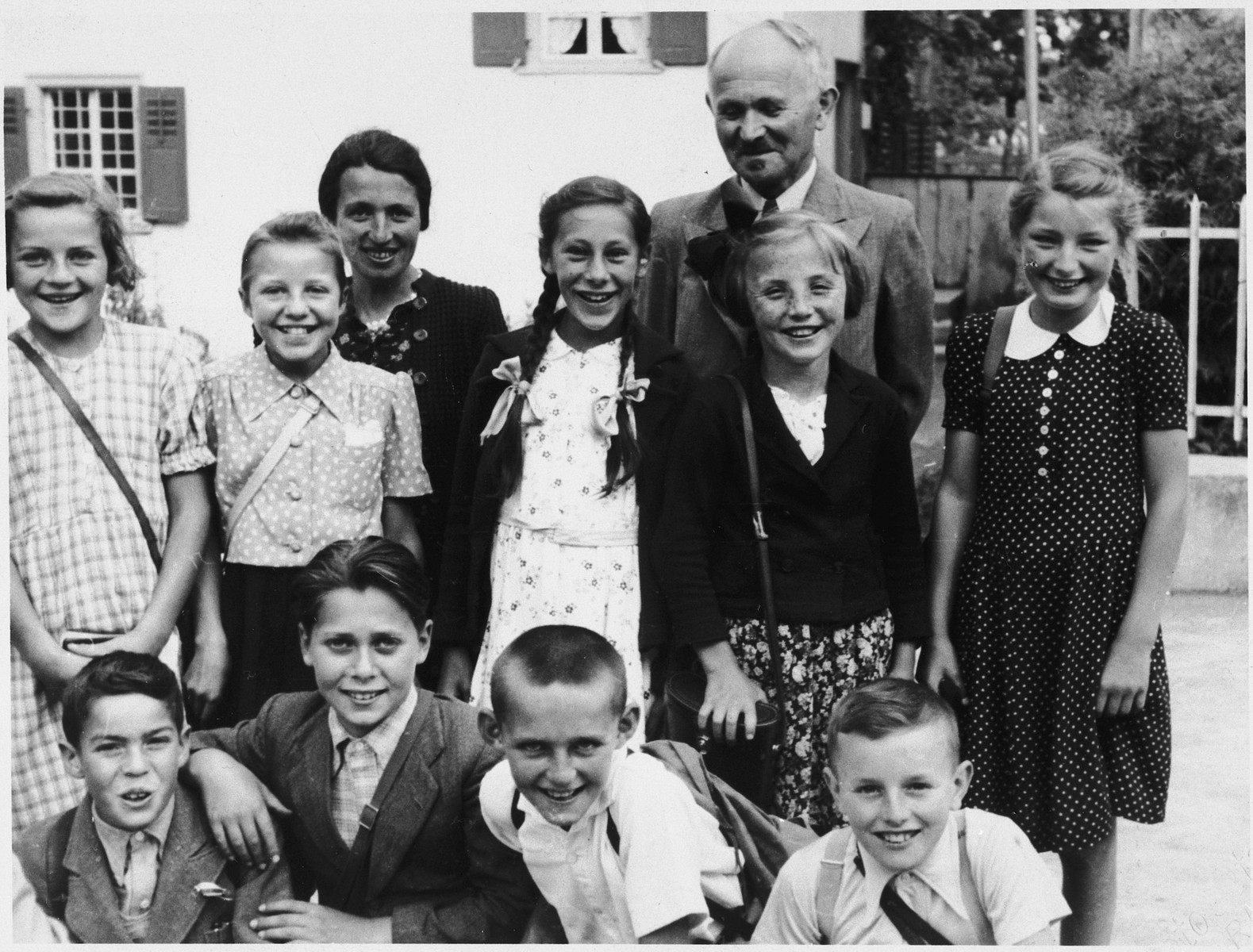 Class portrait of the Protestant school attended by Gerhard Lewitzky while a refugee in Switzerland.

Gerhard is pictured in the front row, second from the left.