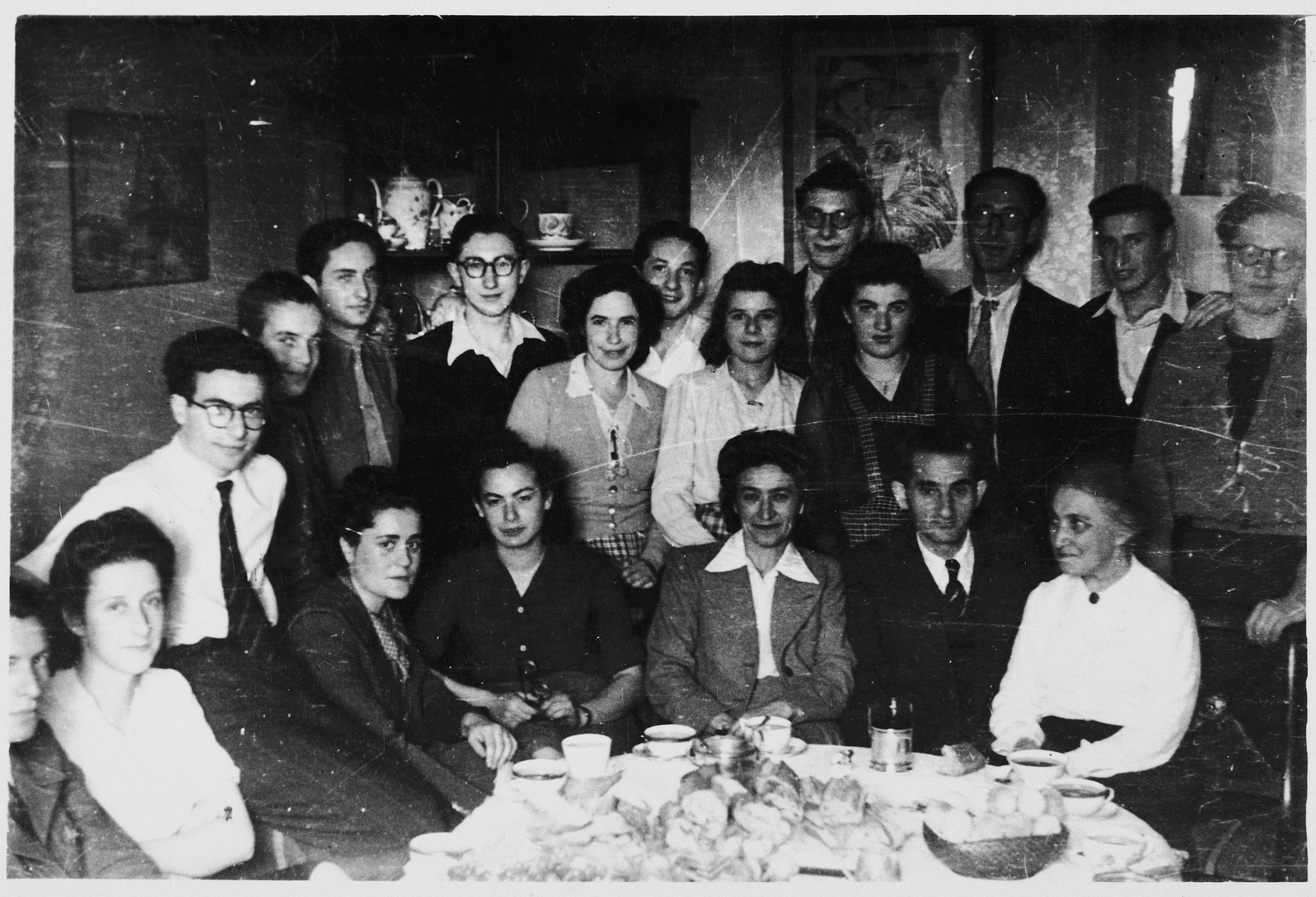 OSE staff and former students attend a party in Paris to celebrate Mr. Koenig's safe return from concentration camp.

Mr. Koenig had been the leather-making instructor in OSE's Chabannes children's home.  Among those pictured are Lida Jablonsky, Fee Beyth, Mrs. Koenig, Mr. Koenig, Mrs. Reich and Wolf Blumenreich (who also returned from concentration camp.)