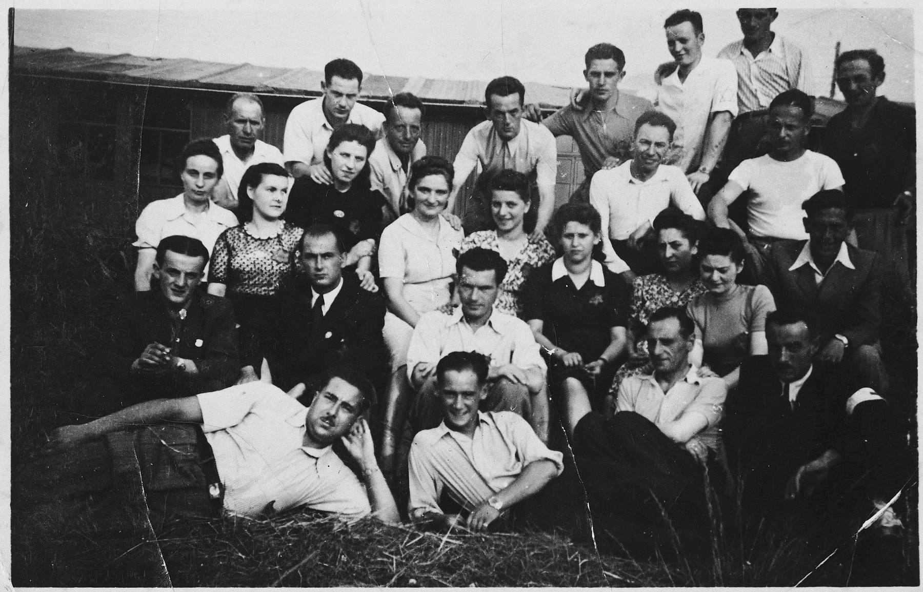 Prisoners in the Markstadt labor camp.

Among those pictured is Dr. Wolf Laitner, seated center, in the white shirt, directly behind the man leaning on his elbow.   Also pictured is Ruth Lieber (later Rydelnik) (second row from the top, third from the left).