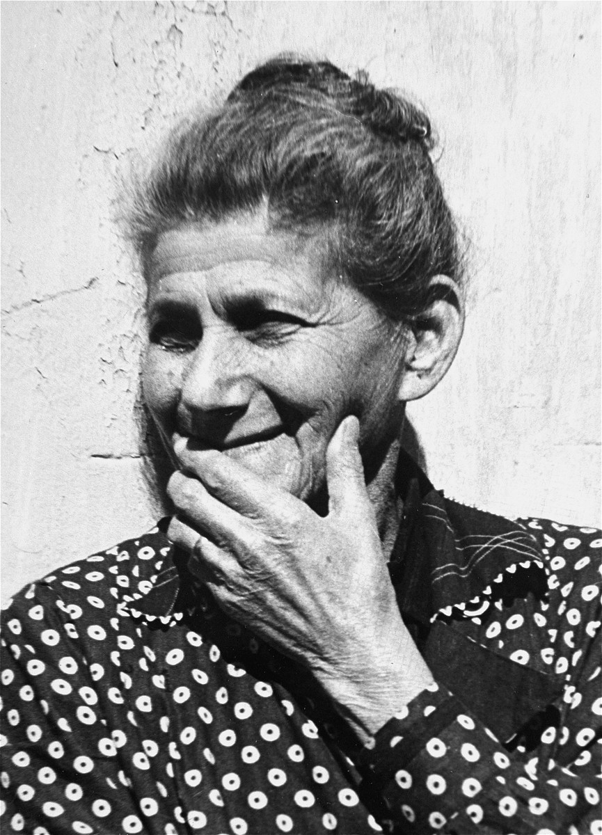 Portrait of an elderly Jewish refugee woman at the Hotel Bompard internment camp.

This photo is from a series taken by Julia Pirotte, a native of the region, who was invited by the "camp" commander to photograph the women and children because "[the] Joint [Distribution Committee] was organizing a banquet."