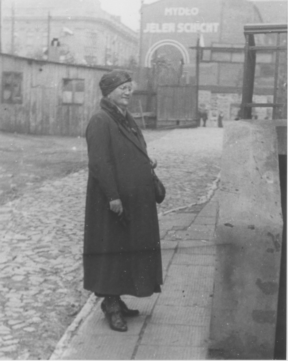 Maria Frajda Laudon poses near the entrance to a soap factory in Bedzin, Poland.