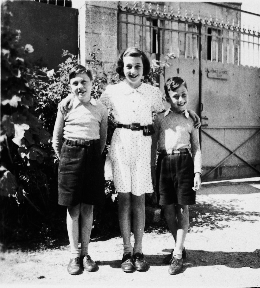 Three Jewish siblings pose outside their home in Gueret.

Pictured are Marianne, Pierre and Louis Schwab.