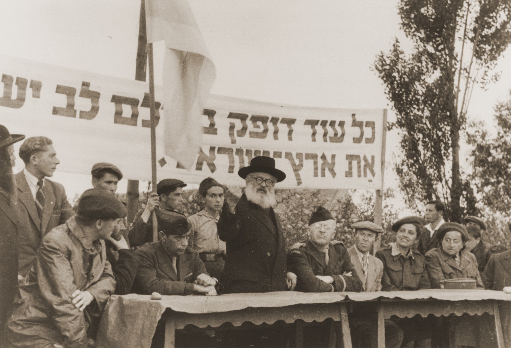 Rabbi Isaac Herzog, Ashkenzi chief rabbi of Palestine, delivers an addresses a Zionist rally at the Neu Freimann displaced persons camp.