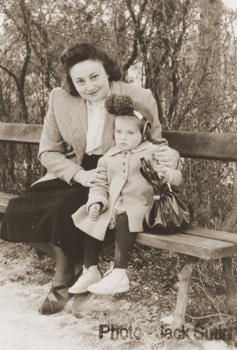 Rochel Sutin sits with her daugher, Cecilia, on a park bench in the Neu Freimann displaced persons camp.