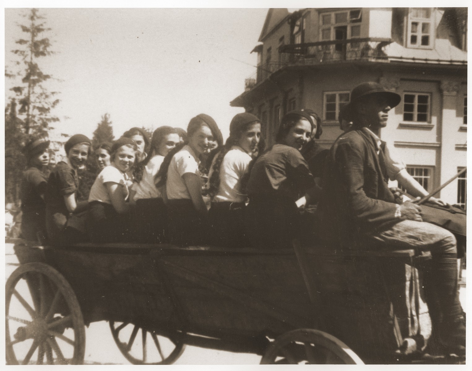 Girls from the Chawatselet Jewish gymnasium in Warsaw ride in a horse-drawn wagon during an outing in Zakopane.  

Pictured from left to right are: Dola Gurfinkel (teacher) Hadassah Goldberg; Hadassah Nerenlender; Sara Buchlender; Luba Garbowicz; Recha Diament; Cypora Rzetelna (teacher); Mina Frydland; and Hela Szapiro.