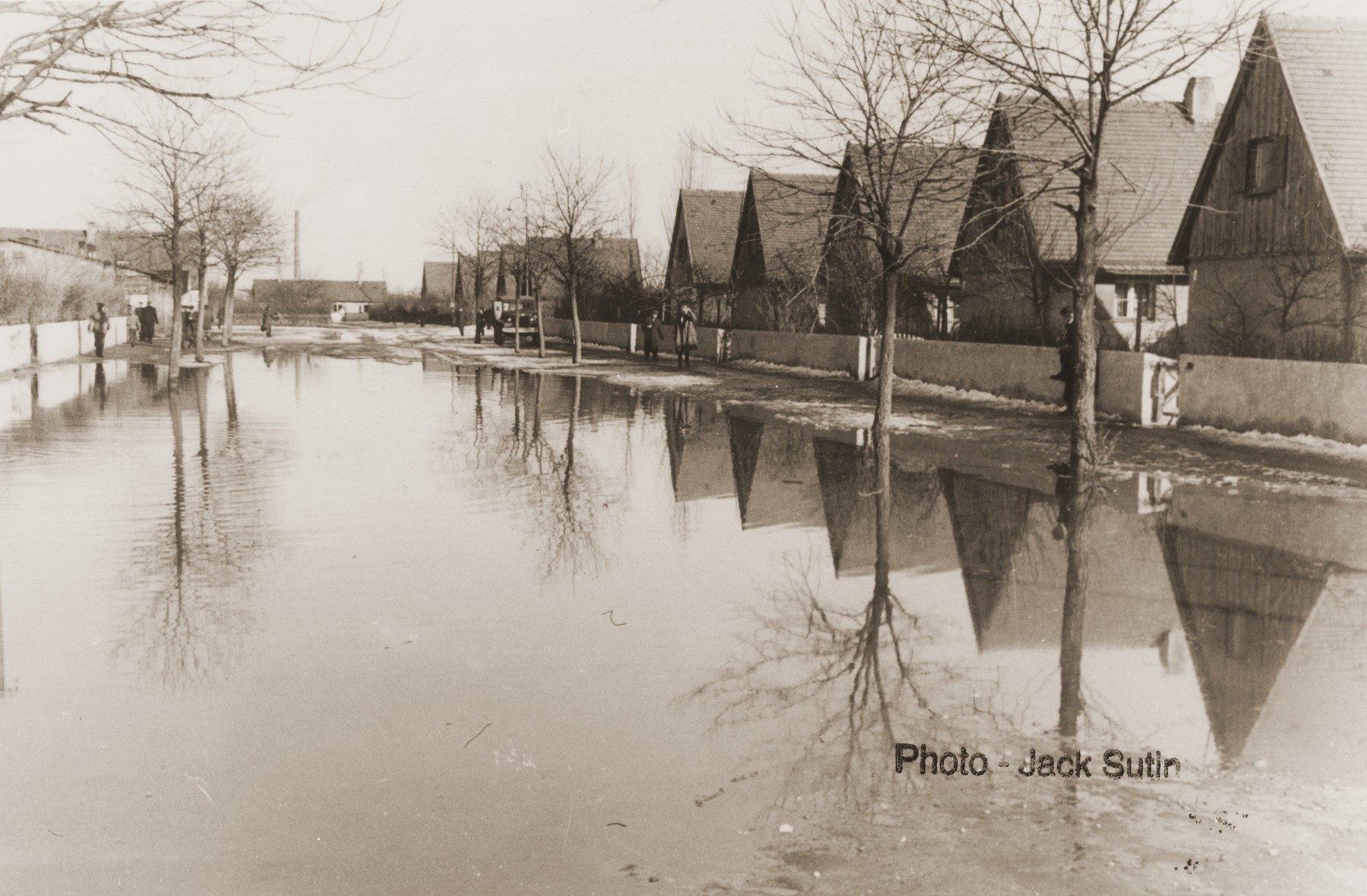 View of a flooded street in the Neu Freimann displaced persons camp.