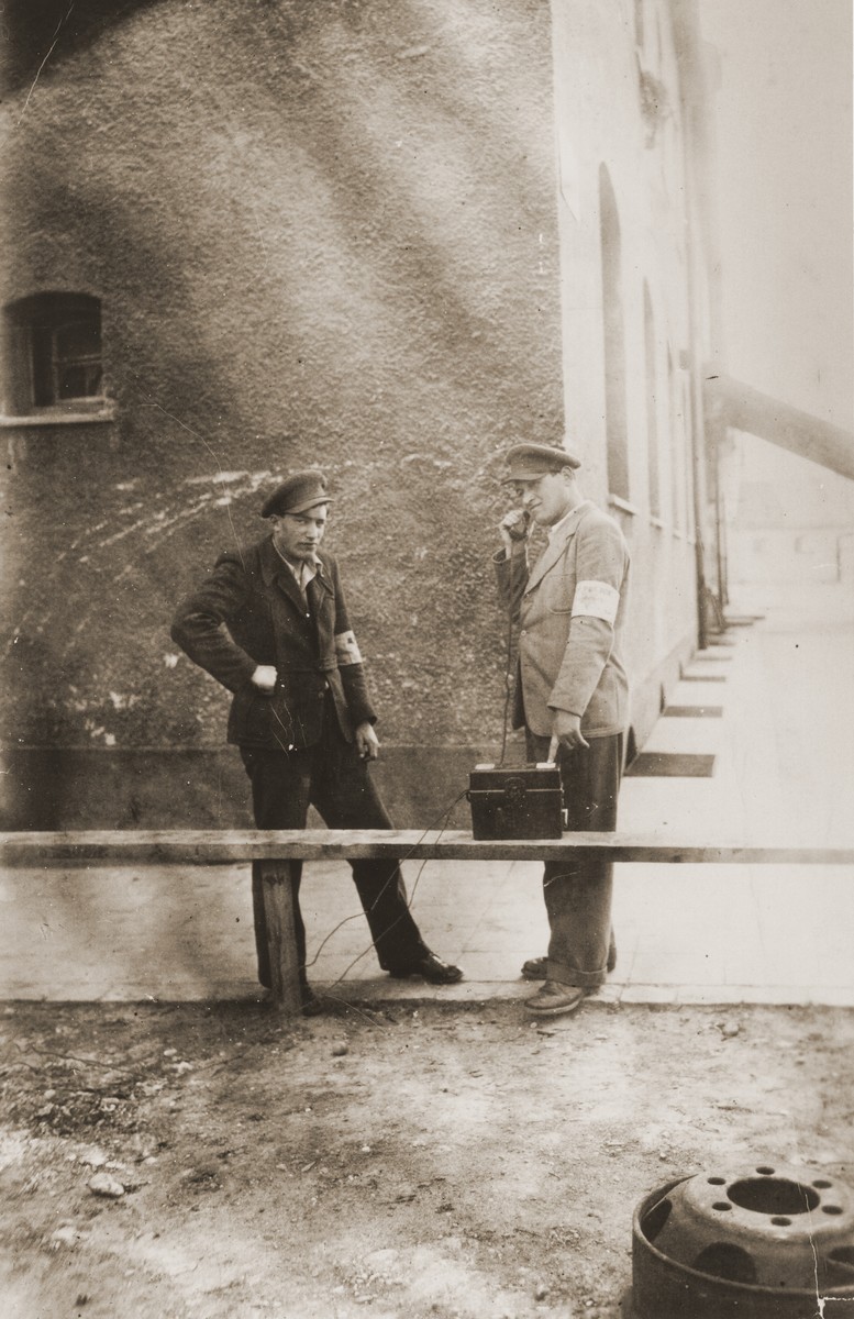 Two Jewish policemen in the Landsberg displaced persons camp.  

Pictured on the left is Szmuel Silbiger.