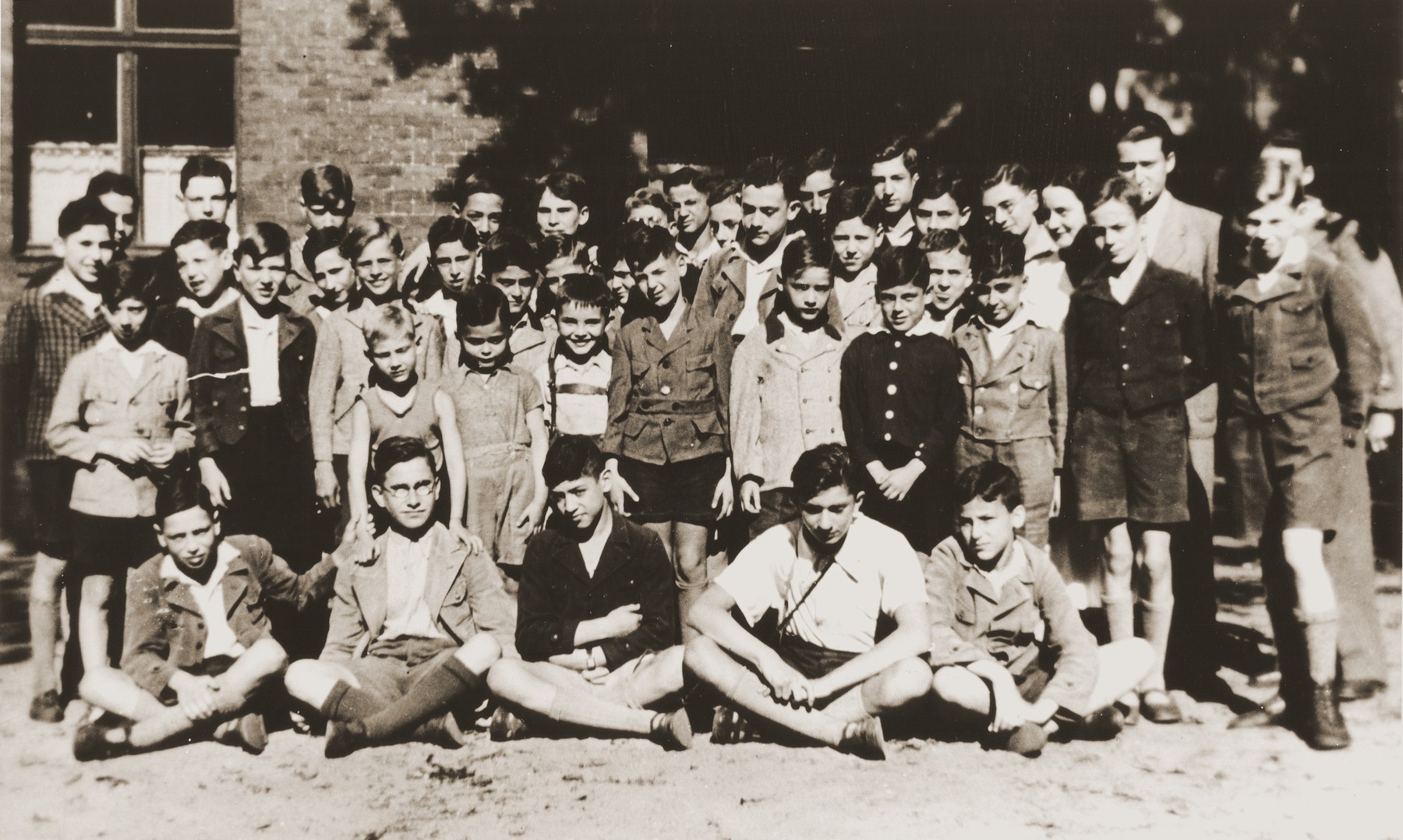 The children living at the Baruch Auerbach Jewish orphanage in Berlin.

Ralph Moratz is standing directly behind the second boy in first row from left and Wolfgang Grajonjz is standing directly next to Ralph on the right (his head is turned downward).