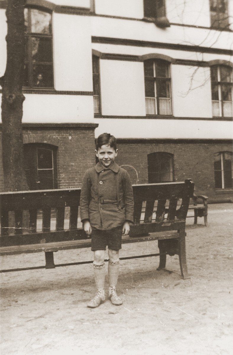 Six-year-old Heinz Stephan Lewy poses in the yard of the Baruch Auerbach Jewish orphanage in Berlin.