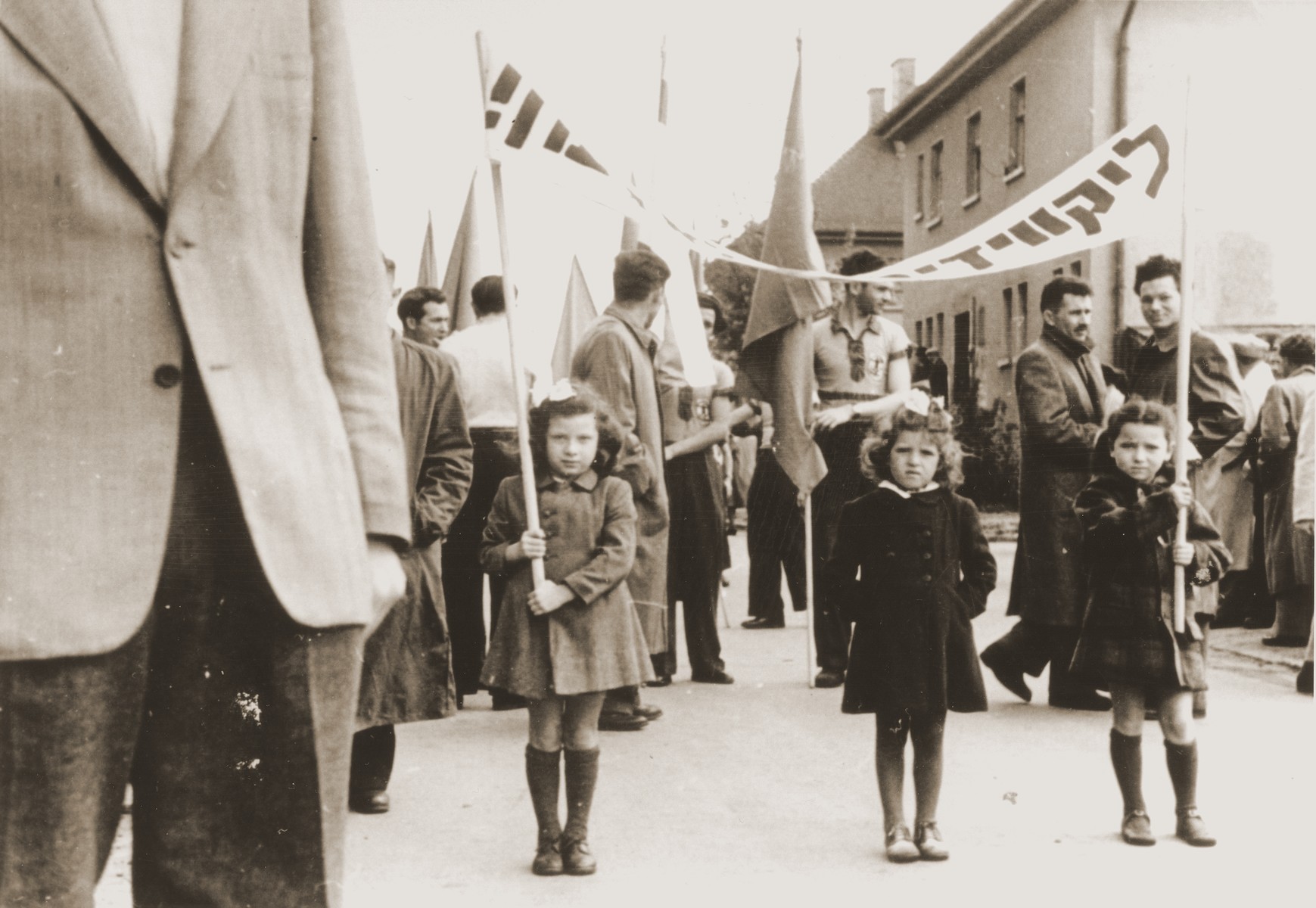Demonstration demanding that the Jews be let into Palestine in the Belsen DP camp.  Stefa Friedfertig holds a banner on the right.
