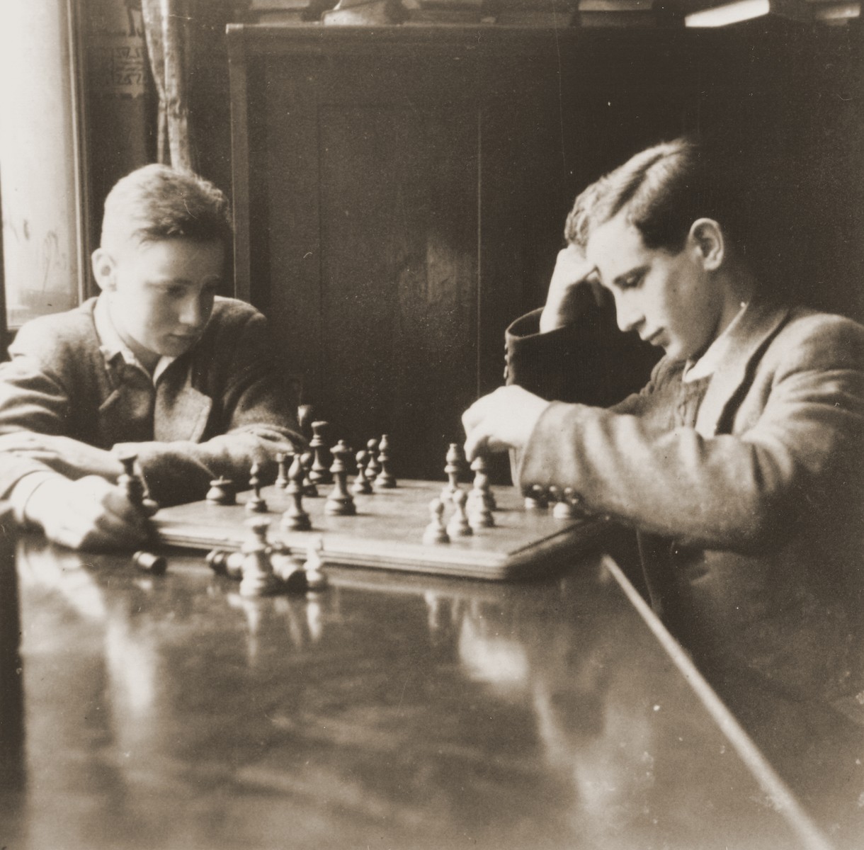 Two youths play a game of chess at the Baruch Auerbach Jewish orphanage in Berlin.