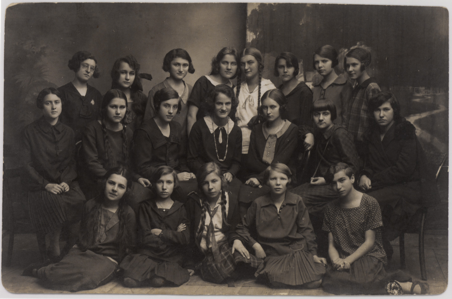Portrait of a group of young women in a gymnasium class in or near Sanok.

Helena Amkraut is pictured in the middle row on the right.