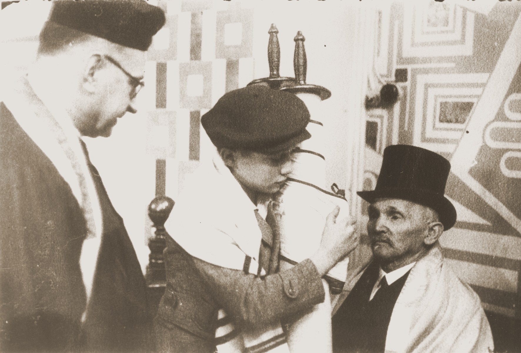 Siegbert Levy hands the Torah scroll to his great uncle (right) during his bar mitzvah at the liberal Zerrennerstrasse synagogue in Pforzheim.