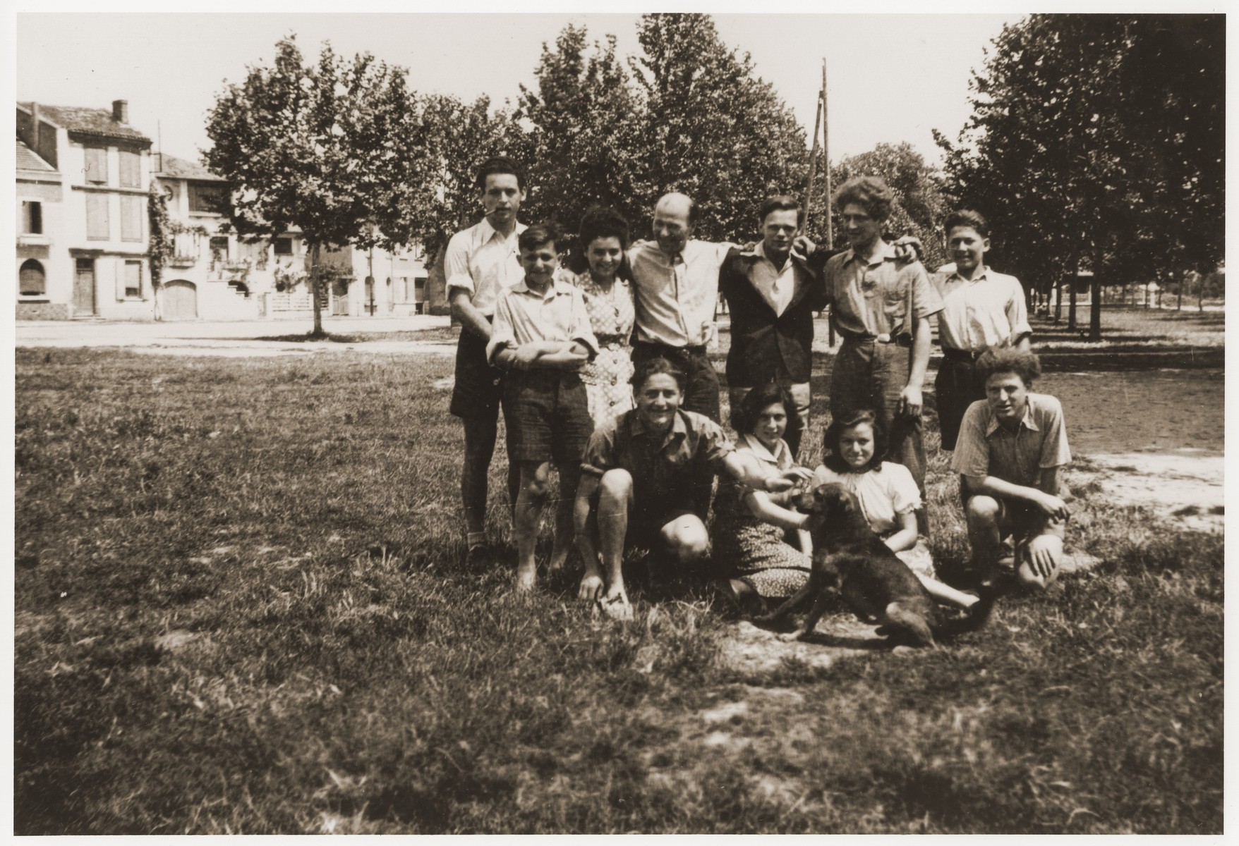 Group portrait of Jewish youth at the Hotel du Moulin in Moissac.  

The Hotel du Moulin residence for displaced Jewish youth was operated by the French-Jewish scouting movement, Eclaireurs Israelites de France.  Among those pictured is Walter Karliner (back row, third from the right).