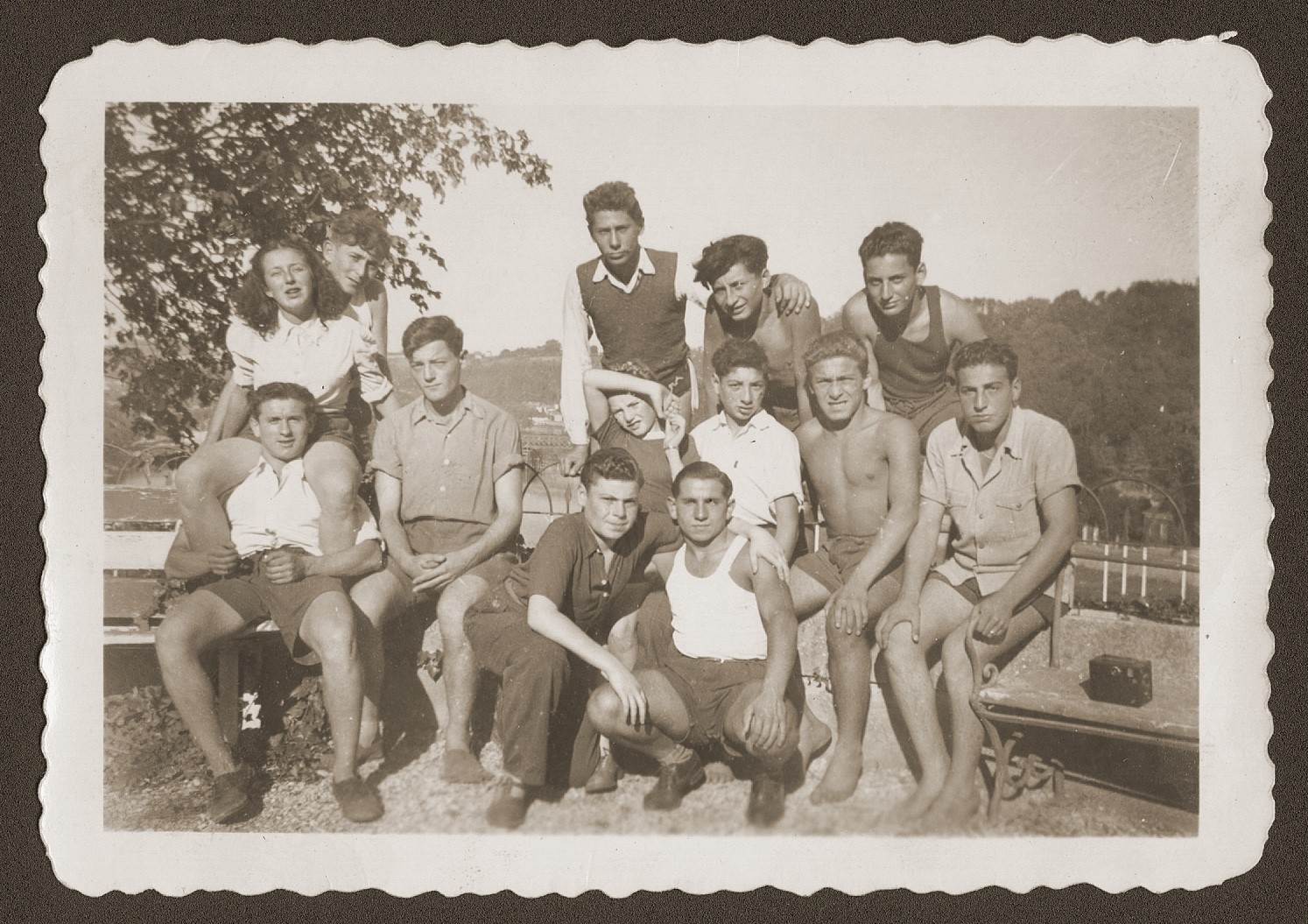 Group portrait of Jewish youth living at the OSE (Oeuvre de Secours aux Enfants) children's home at Collognes au Mont d'or.  

Among those pictured are Siegfried Weissmann (first row in the white tank top) and Kurt Leuchter (standing on the far right).