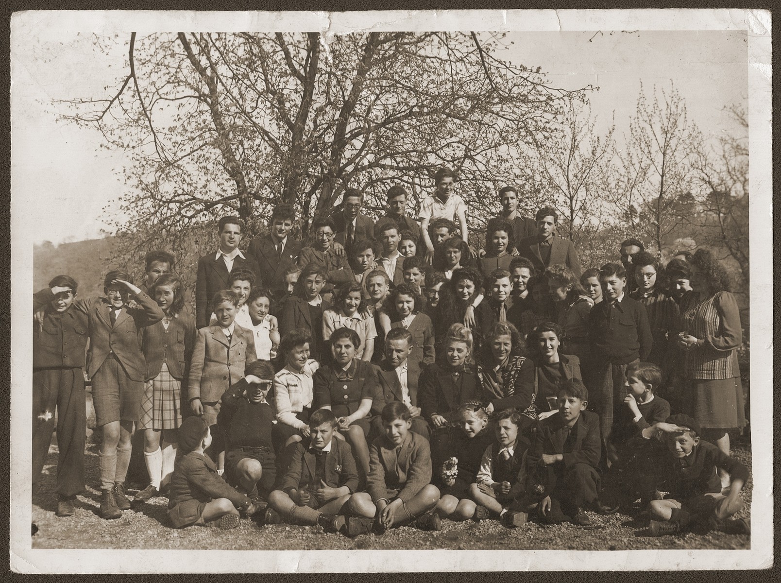 Group portrait of Jewish youth and staff from the OSE children's homes at Collognes and Le Tremplin.
  
Among those pictured are the directors of the Collonges home, Mr. and Mrs. Hannau (second row, center) and Yvonne Rocque, director of Le Tremplin (second from the right).