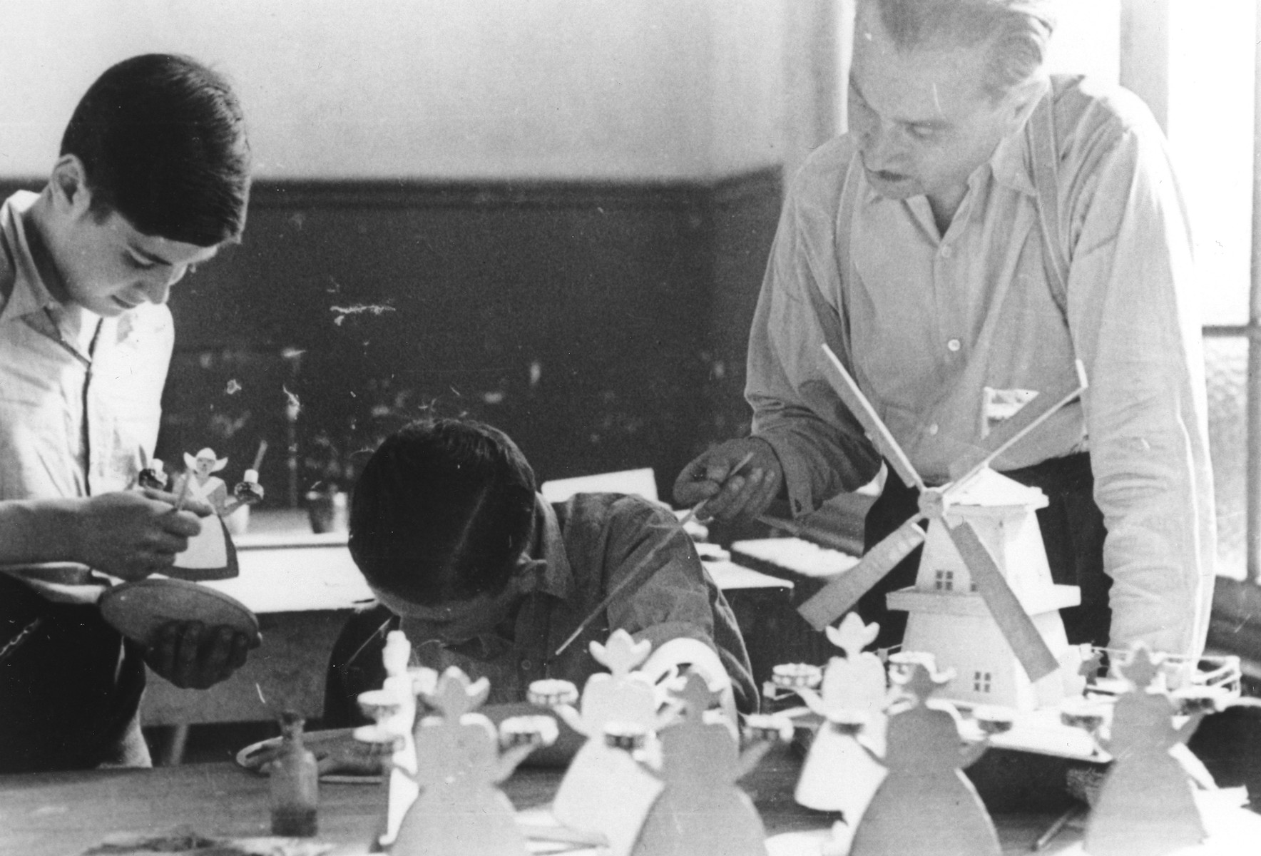 Two Jewish boys make figurines in a woodworking class in the Ecouis children's home.

Pictured at the left is Hans Oster, and in the center is Ivar Segalowitz.