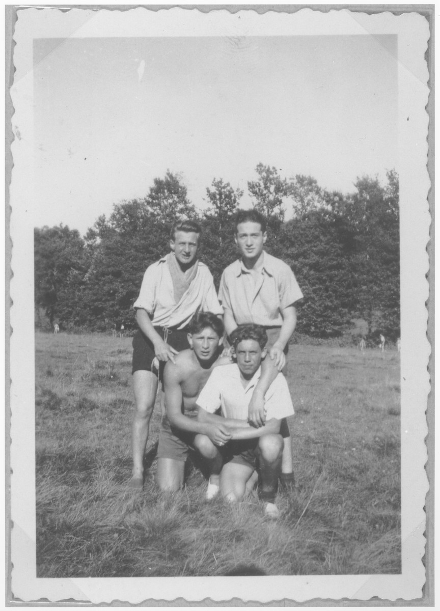 Four Jewish youths pose in an open field near the Champigny children's home.

Leon Sapper is at the bottom, left.