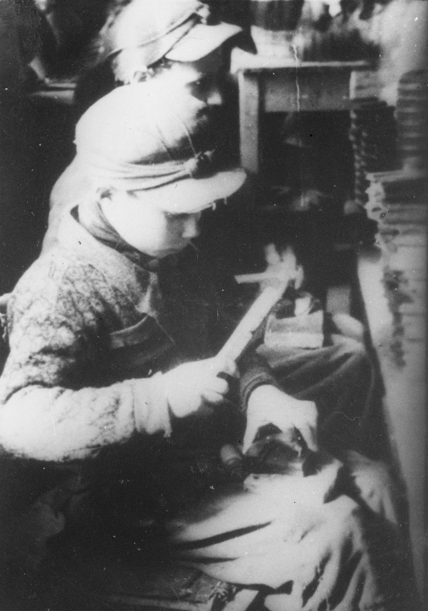 Jewish children at forced labor in a workshop in the Lodz ghetto.