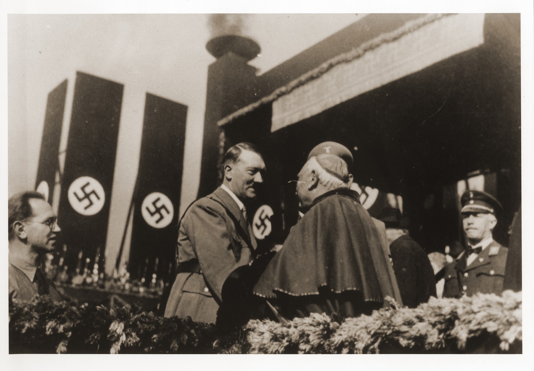 Adolf Hitler greets Munich Nuncio Archbishop Alberto Vassallo di Torregrossa, Munich, 1933. The occasion was probably the ground stone laying ceremony at the Haus der Kunst (Art Exhibition Hall) in Munich, October 15, 1933. The Vatican subsequently protested the Nazi Party's use of the photograph for election propaganda.