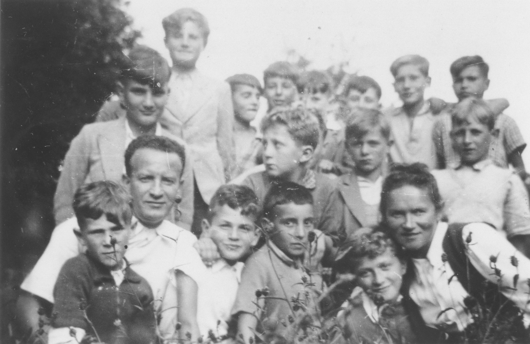 OSE teachers Mr. and Mrs. Zitta Zylberstein pose with a group of children outside the Chabannes children's home.

Also pictured are Albert Nadel, Anatole Zylberstein, Gunter Moser, David Nadel, Hans Stern, Kurt Fischof, Norbert Bikales, Michel Bronsztein, Arno Marcuse, Georges Wajnberg, Berthold Friedlaender, Herbert Abormitter, Klaus Gossels, Gerhard Glass, and Alfred Nowack.