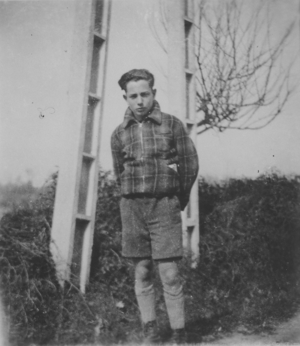 Portrait of the Jewish refugee child Gerard Alexander standing in front of the Chabannes children's home.