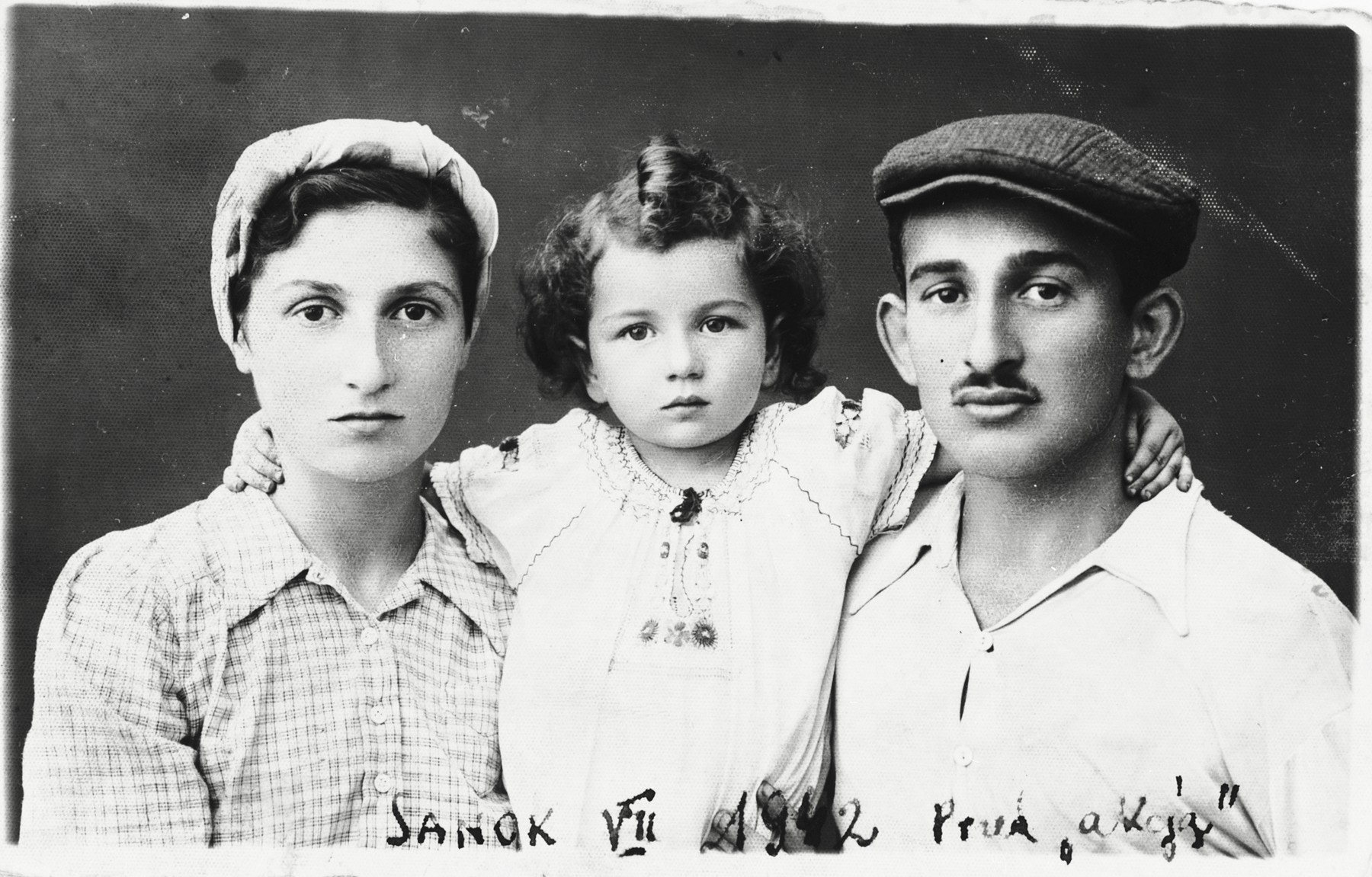 Studio portrait of the Majranc family taken shortly before they went into hiding.

Pictured from left to right are Steffa, Marylka and Tadek Majranc.