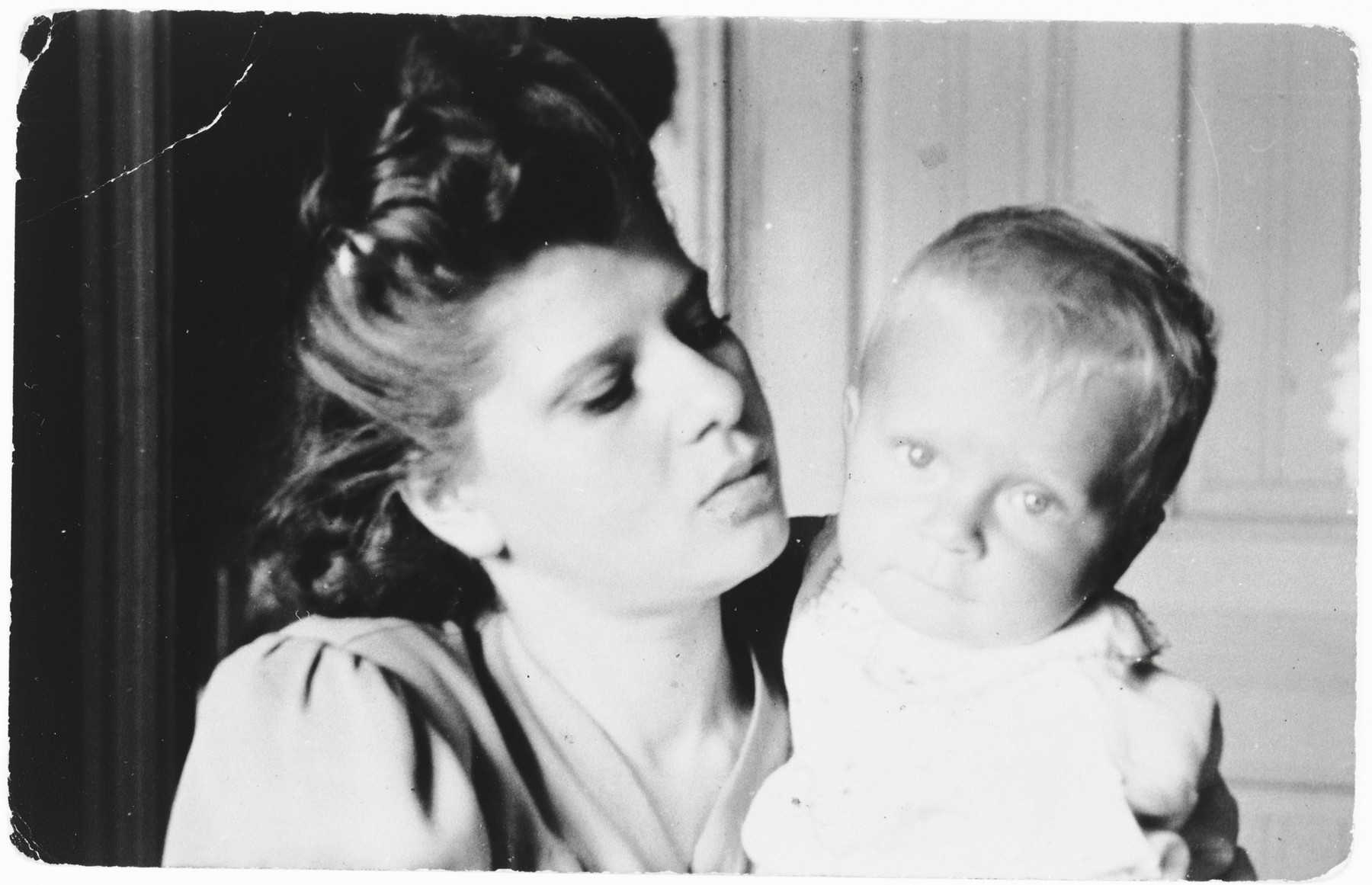 Nina Szapszewicz Ginter holds her infant son, Bogdan, while posing as a Polish woman in Warsaw.