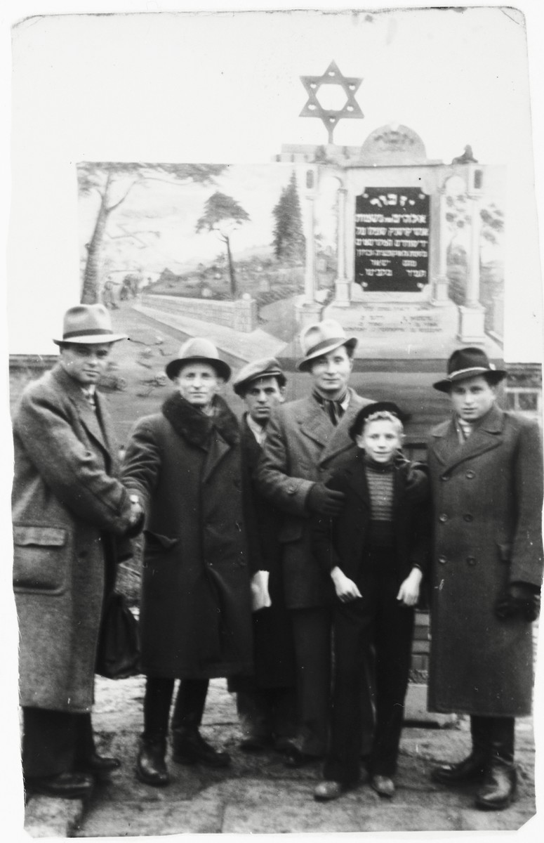 Jewish DPs stand in front of a memorial to Holocaust victims from Krasnik in the Zeilsheim DP camp.

Szlomo Waks is standing second from the right.