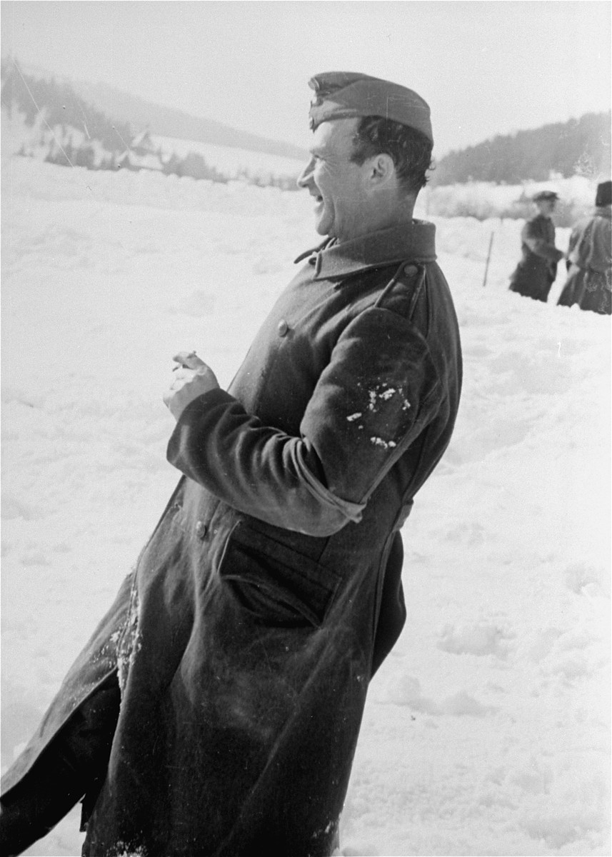 A Jewish conscript in Company 108/57 of the Hungarian Labor Service smoking during a break from work.
