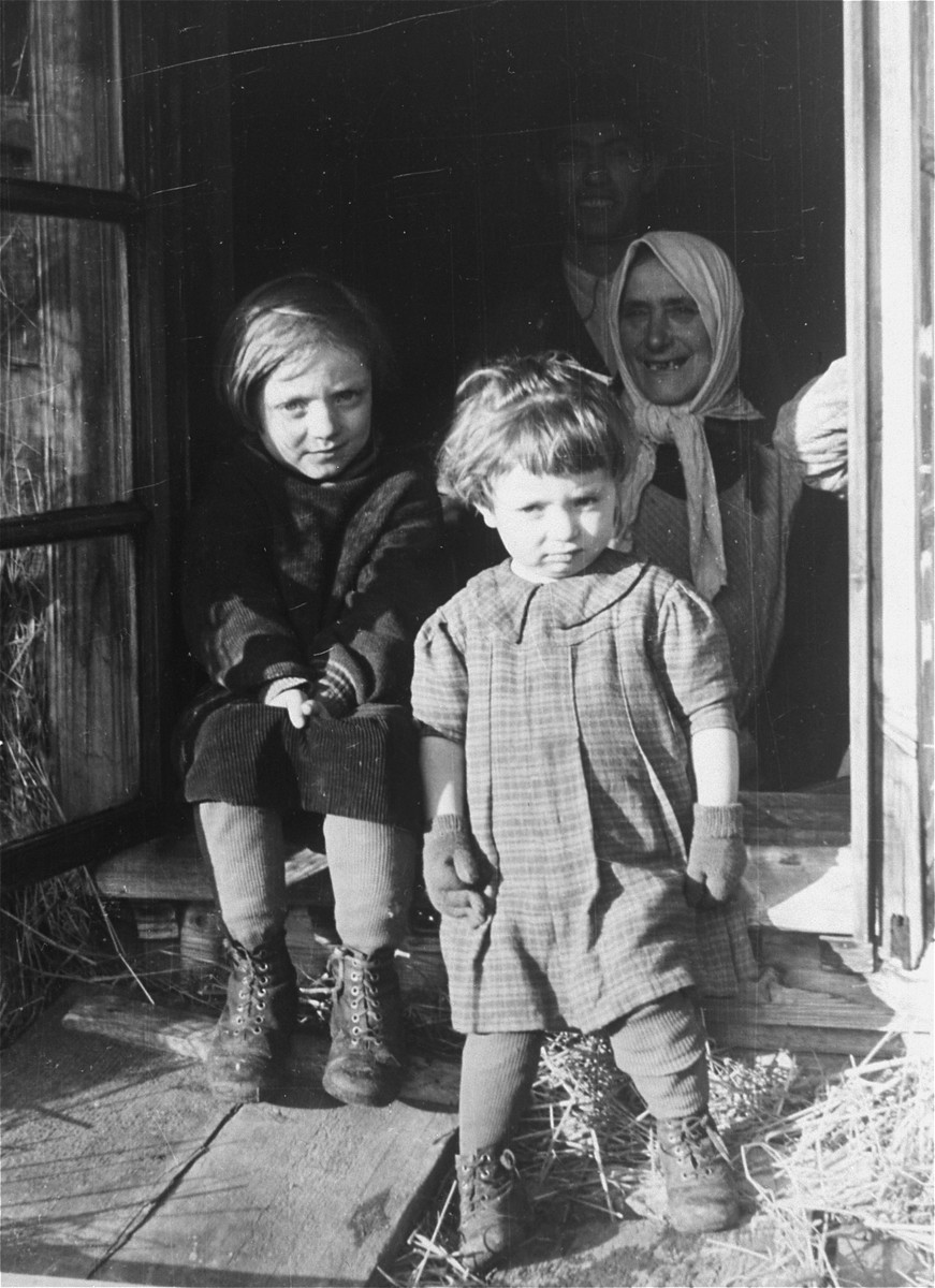 A Jewish family stands in the doorway of their home near the Hungarian-Jewish Labor Camp where Company 108/57 was housed.