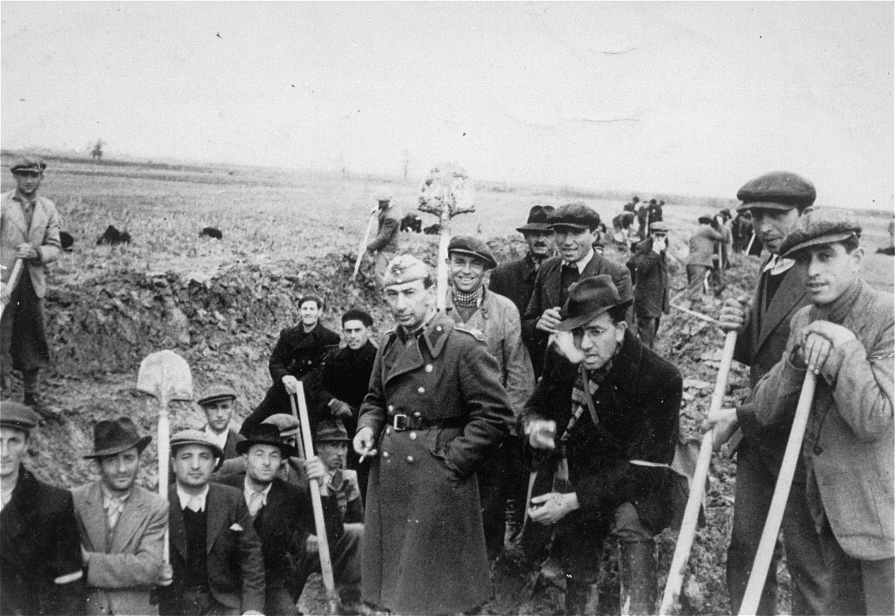 Jewish members of an Hungarian labor battalion pose with shovels at a work site.

Among those pictured is Salomon Belo from the town of Bene (third from the left).