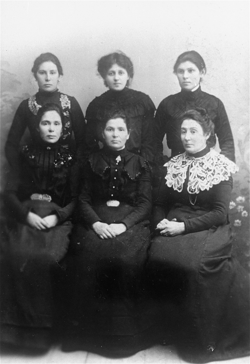 Studio portrait of six Jewish women in Vilna.

Pictured are Genya (Settel) Magid) and her five sister-in-laws.  In the back row, from left to right are: Rachel Ass, Genya (Settel) Magid, Tzvia Rudashevsky, Esther Eppel, Rivka Garber and Fanya Mikalavefskaya.