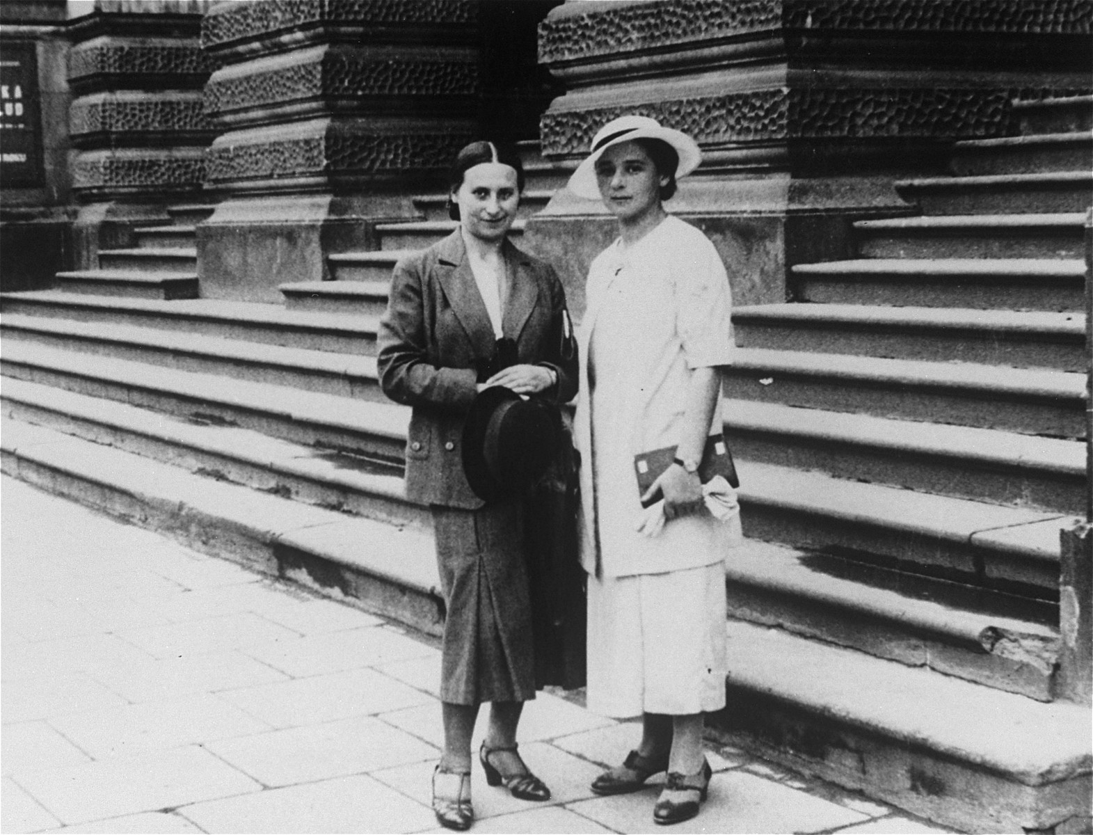 A young Jewish woman poses with a friend on the street in Warsaw, Poland.

Pictured is Yona Rudashevsky (right), the aunt of donor Cilia Rudashevsky.  Yona studied nursing in Vilna and then worked in a Jewish hospital in Warsaw.  In 1935 she immigrated to Palestine, where she worked as a nurse in the Belinson hospital.