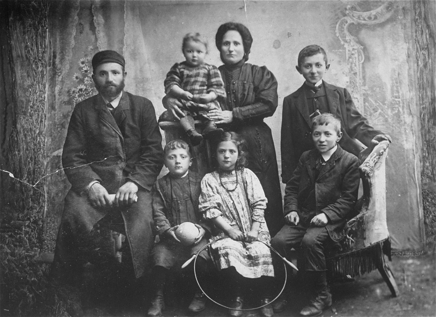 Family photograph of Samuel and Rachel Weiss and their five children: Sarah, Regina (donor's mother), Max, David and Adolph.

The Yiddish inscription on the back reads: To Elke Malche Weiss: Dear sister, I don't know where you are. Send me your address. Sent by your brother.
Samuel Weiss died before the war, Rachel and Sarah perished in the Holocaust. Max, David and Adolph immigrated to the U.S via Argentine in the early 1940's. Regina survived Auschwitz and Dachau, came to the U.S after the war, where she met and married Jack Roth.