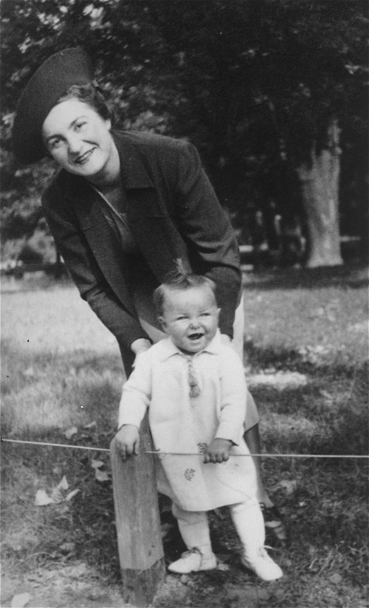 A young Jewish mother poses with her infant daughter in a park in Lvov.

Pictured are Laura Schwarzwald and her daughter Selma.