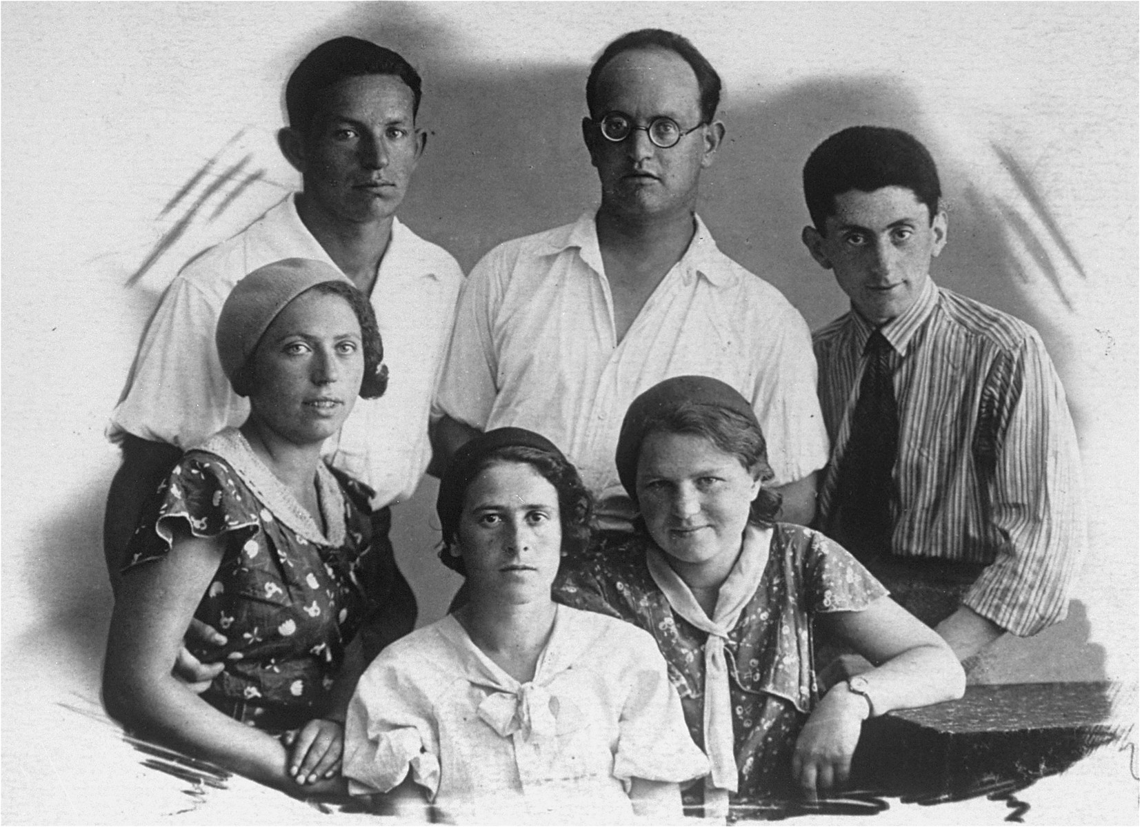 Studio portrait of members of the Rudashevsky family in Vilna. 

Pictured in the back row from left to right are: Shika Jurer, Avraham Jurer and Mula Mirsky.  In the front row from left to right are: Hannah Jurer, Rosa Rudashevsky, and Sarah Rudashevsky.
