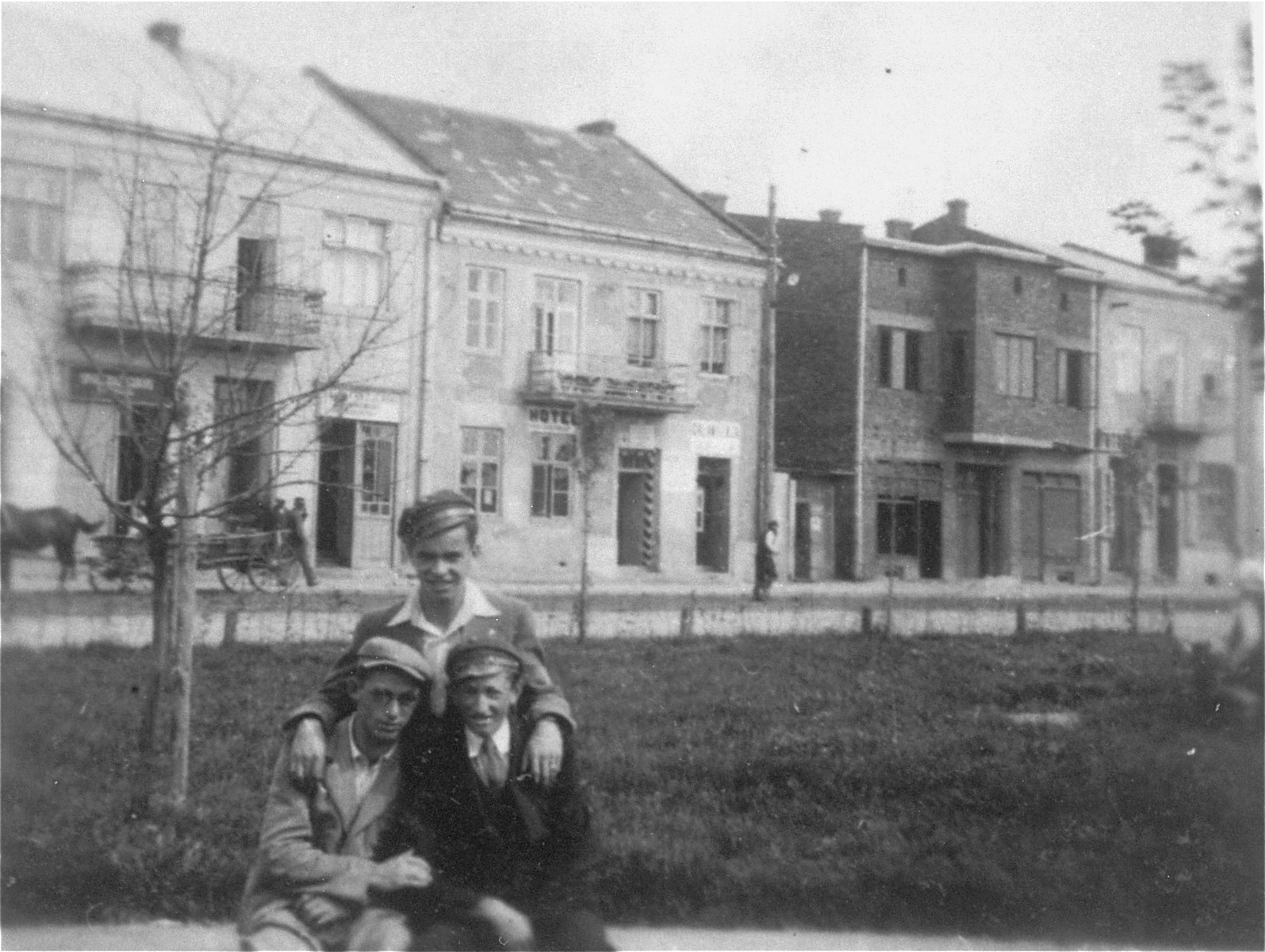 Joshua Heilman with two friends in the center of Lubaczow.