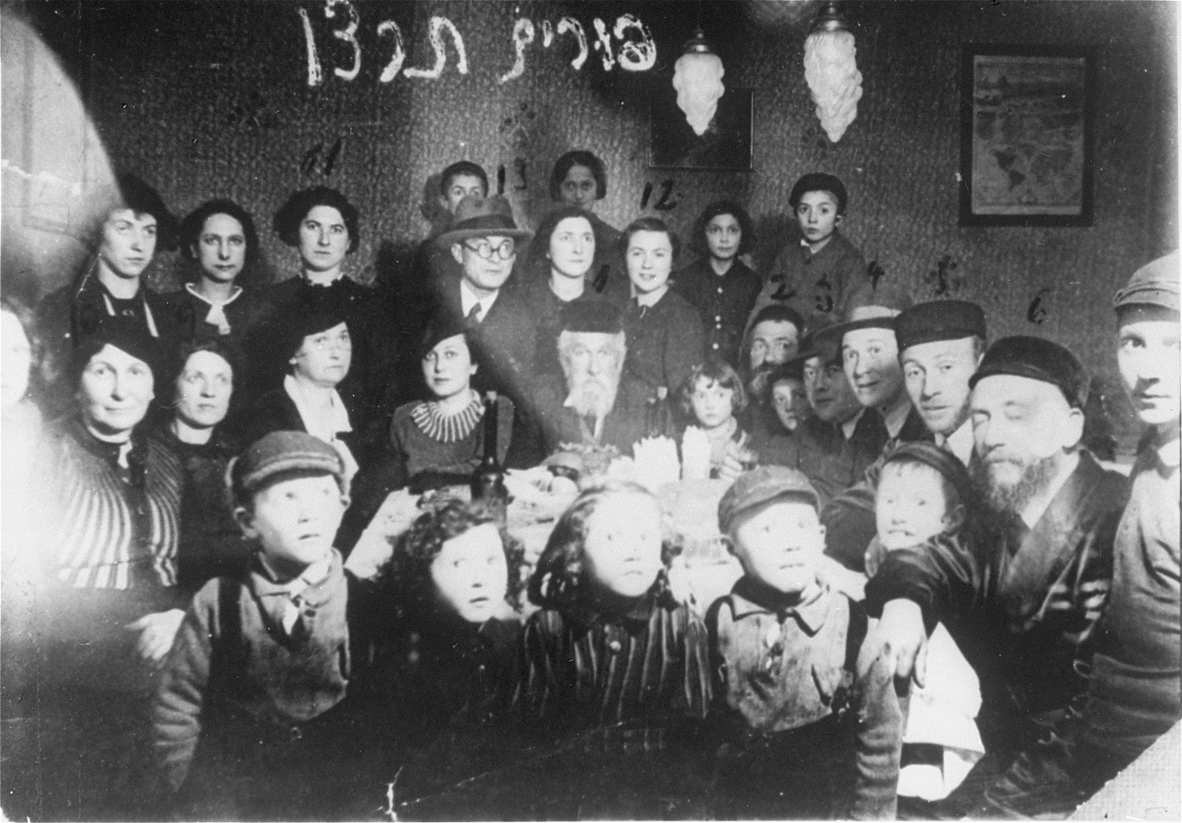 Members of the extended Rosental Vigotska family attend a family celebration on Purim. 

Among those pictured are Yona Wygocka Dickmann and Hajr Naselewicz Chume, two of the three members of the extended family who survived the war.