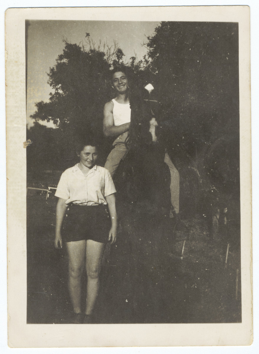 A young man on a horse poses next to his girlfriend in Kibbutz Gan Shmuel.

Pictured are Miriam Domawaska and Josef Fischer.