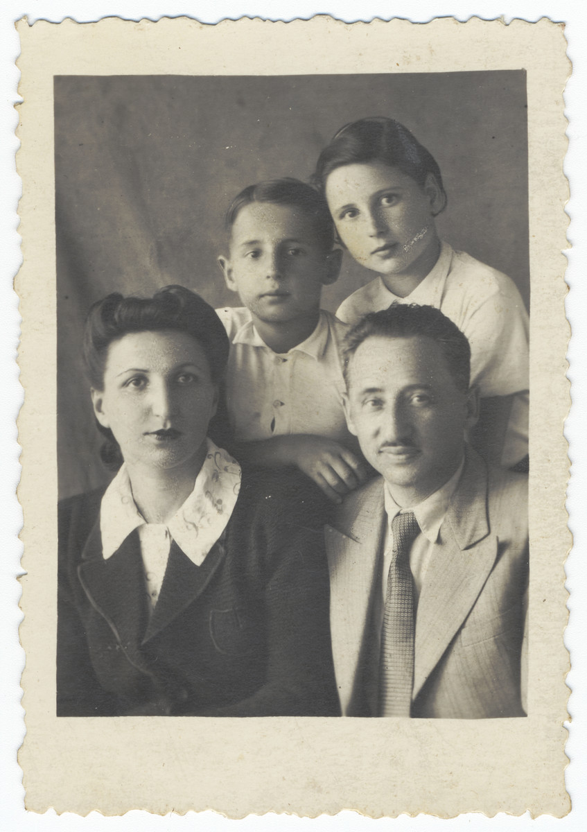 Studio portrait of a Polish Jewish family in Uzbekistan.

Pictured are Lotte and Herman Schlachet and their children, Janina and Aleksander.