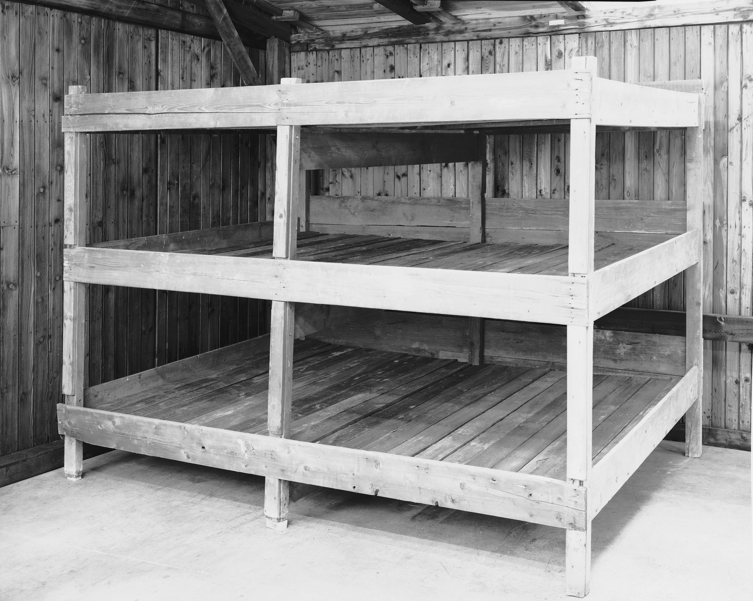 View of the reconstructed bunks from a barracks in Auschwitz on display in the permanent exhibition at the U.S. Holocaust Memorial Museum.