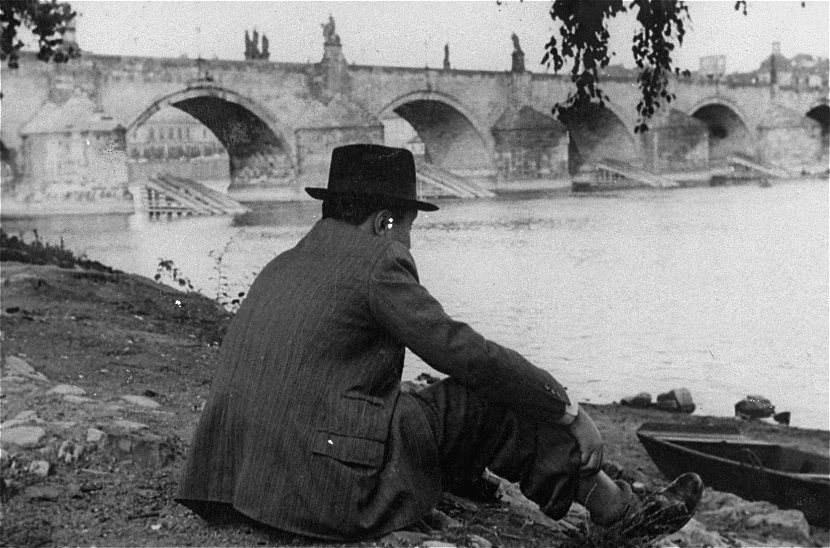 Portrait of Franta Kohn near the Charles Bridge over the Moldau river, one day after he returned to Prague.
