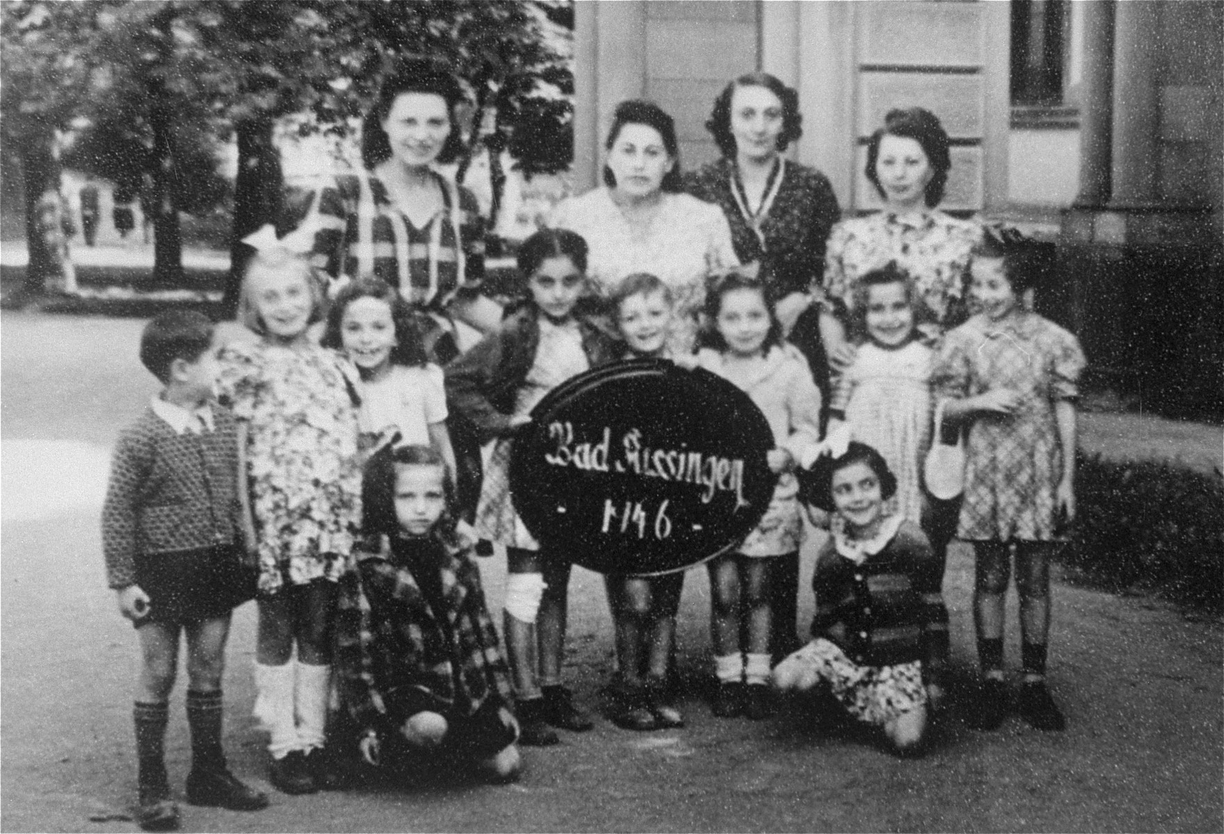 Group portrait of Jewish DP women and children at the Bad Kissingen displaced persons camp.  The children survived the war in hiding.

Among those pictured is Esther Zelowicz (now Edith Cove) standing in the back row, first on the left.
