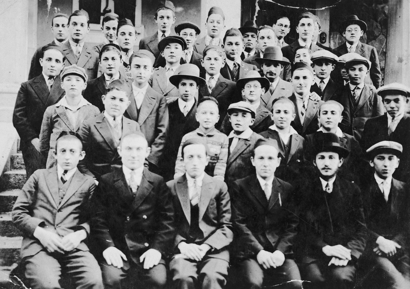 Group portrait of students in a Hungarian yeshiva.

Pictured in the top row is Josif Frankel.